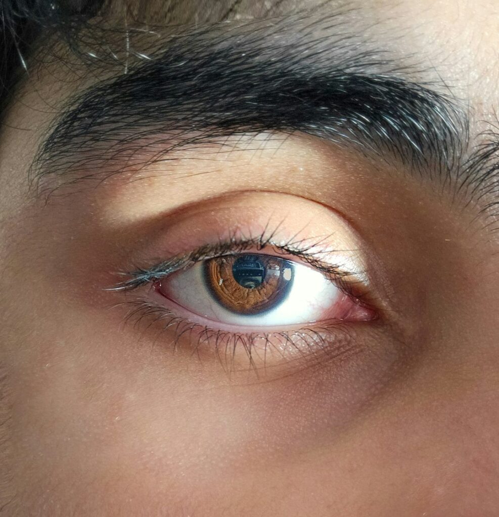 Close-up photo of a brown human eye.