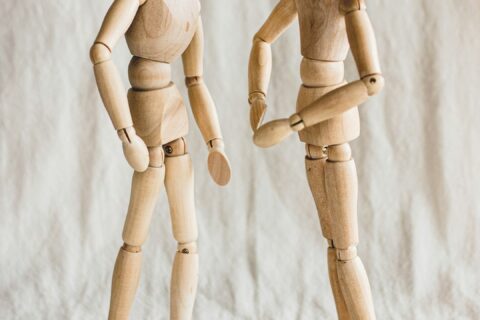 two wooden dolls