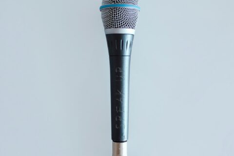 black and gray corded microphone