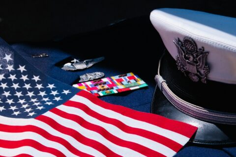 an american flag laying on top of a uniform