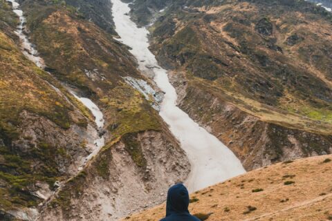 man standing on hill