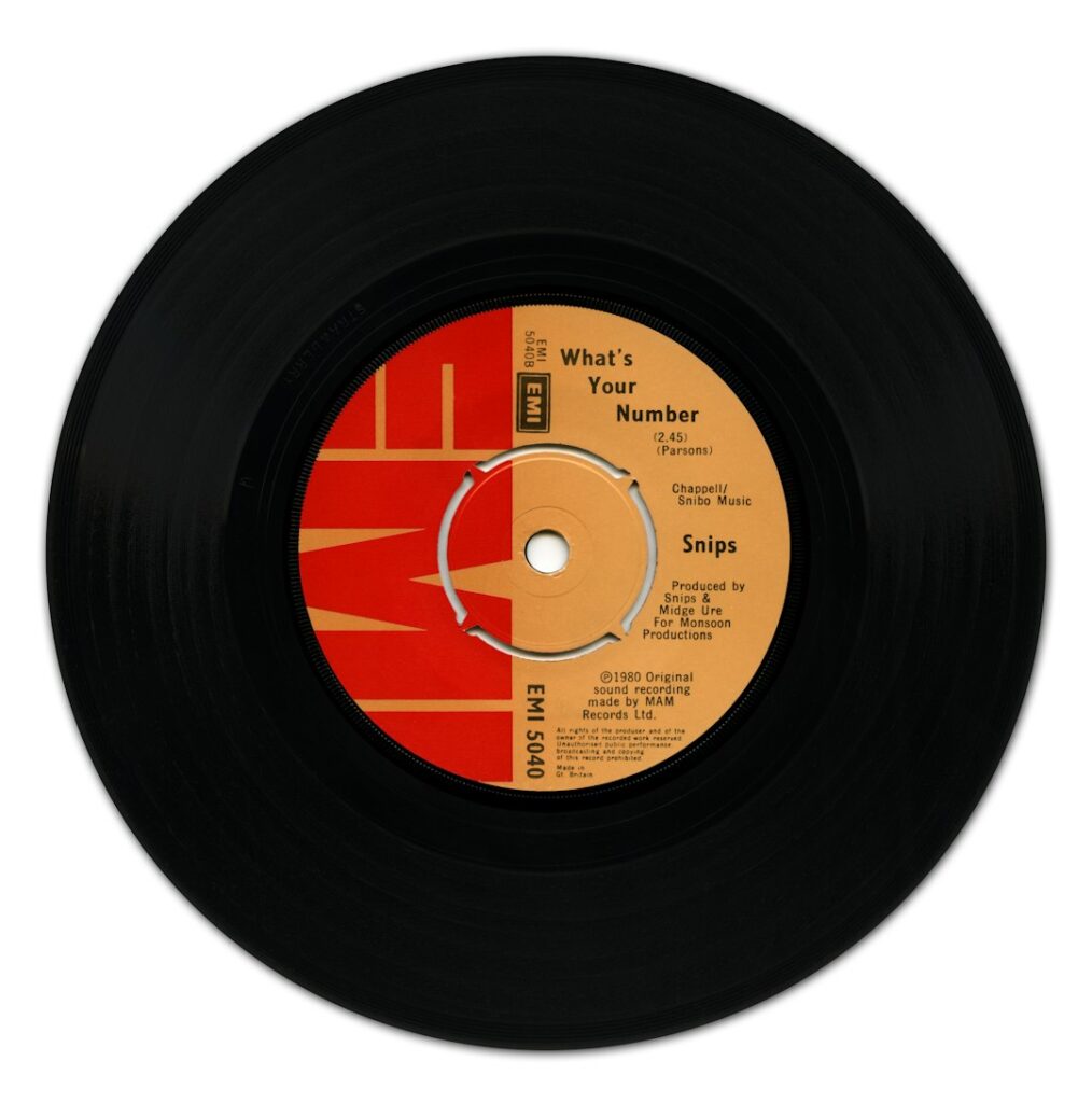 A black vinyl record with a red and orange EMI label