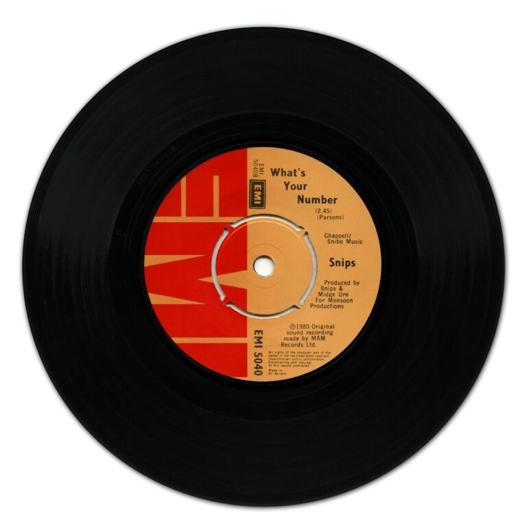 A black vinyl record with a red and orange EMI label