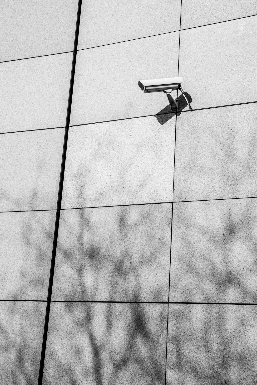 Security camera mounted on a modern building exterior